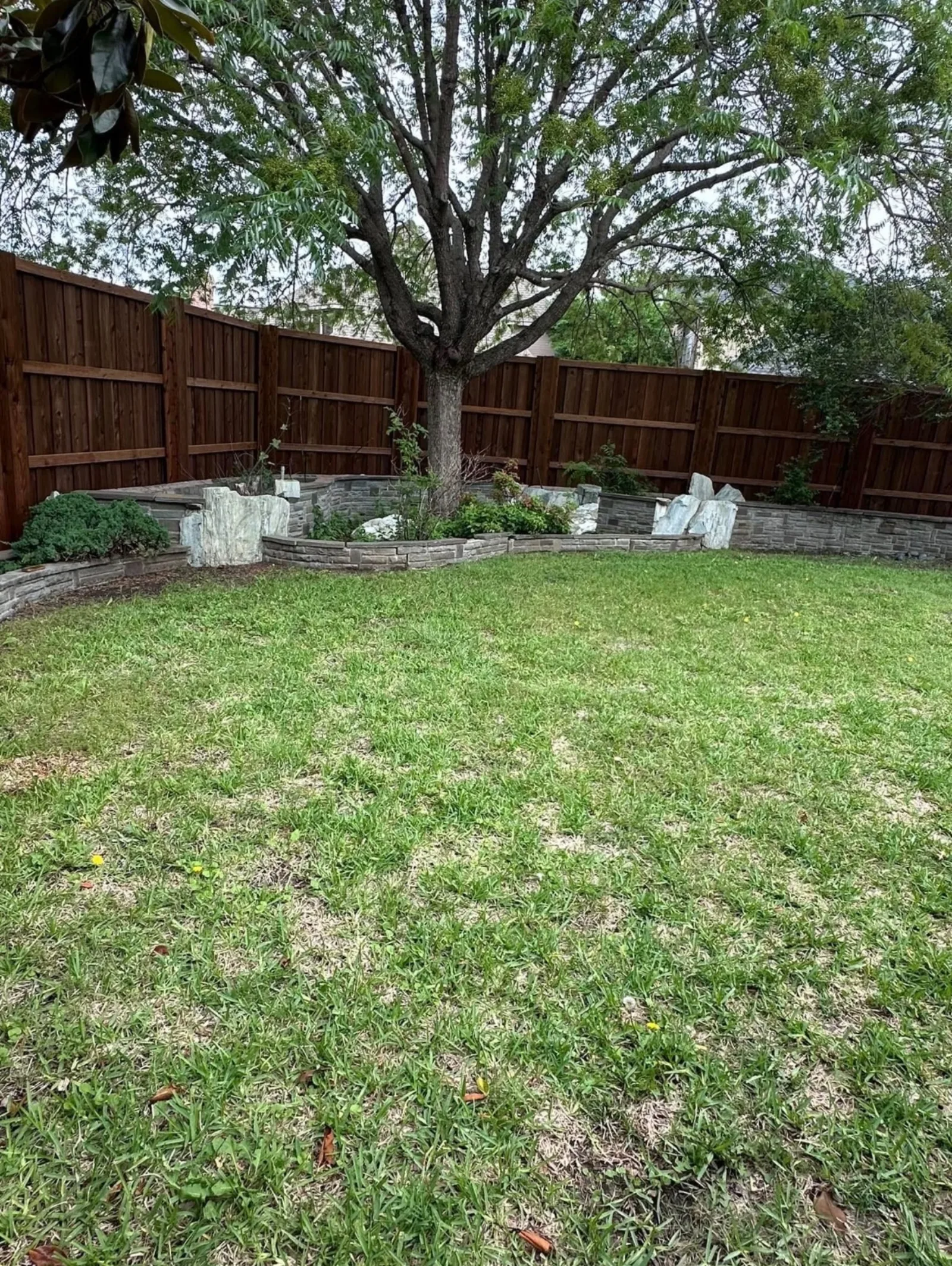 Cedar Privacy Fence on Stone Retaining Wall