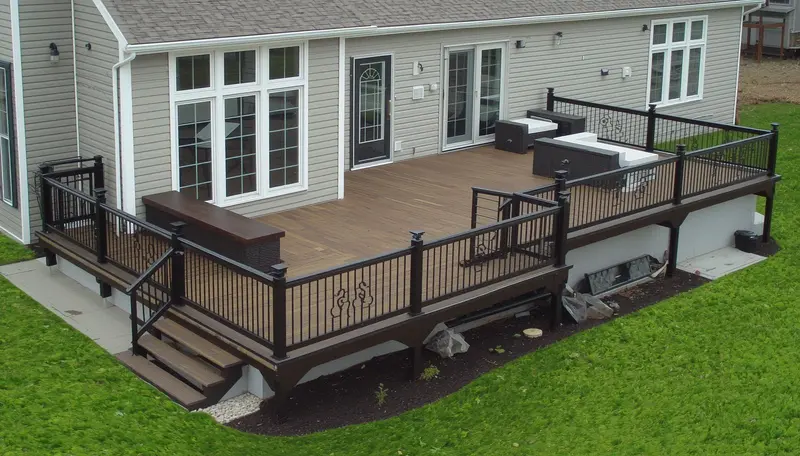 Composite deck with ornamental iron railing — deck contractor near me