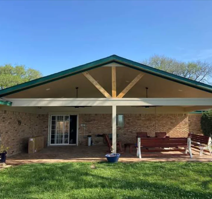 Finished gable patio cover with white columns and ceiling fans built by Forged Fence & Deck in Pearland, TX