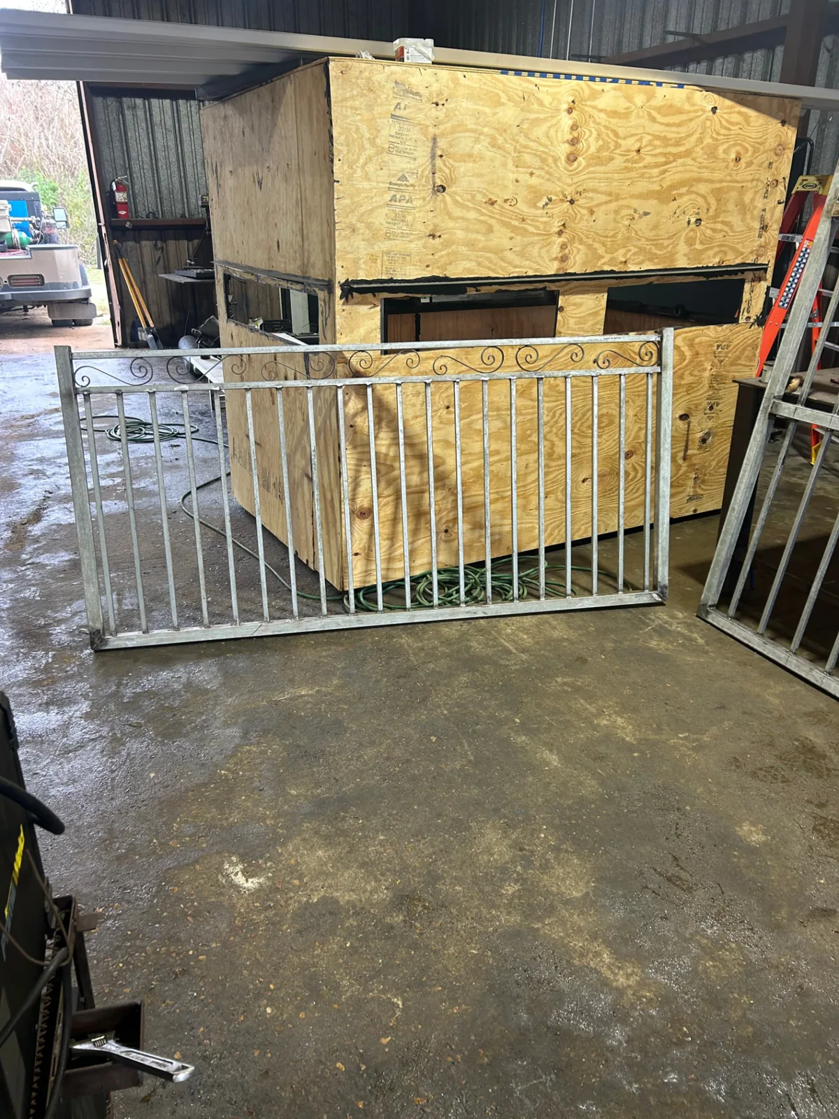 Galvanized scroll-top iron fence panel ready for install on a Pearland, TX property