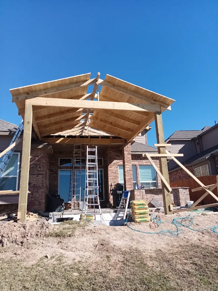 Gable patio cover framing under construction by Forged Fence & Deck in Pearland, TX